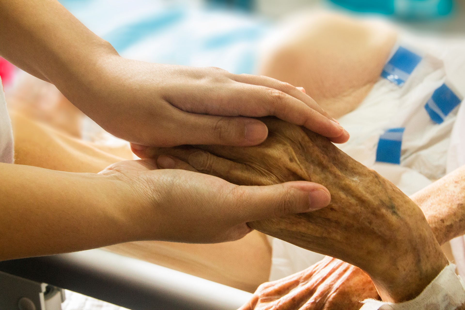 hand-in-hand-1686811_1920 Who pays for hospice care at home?